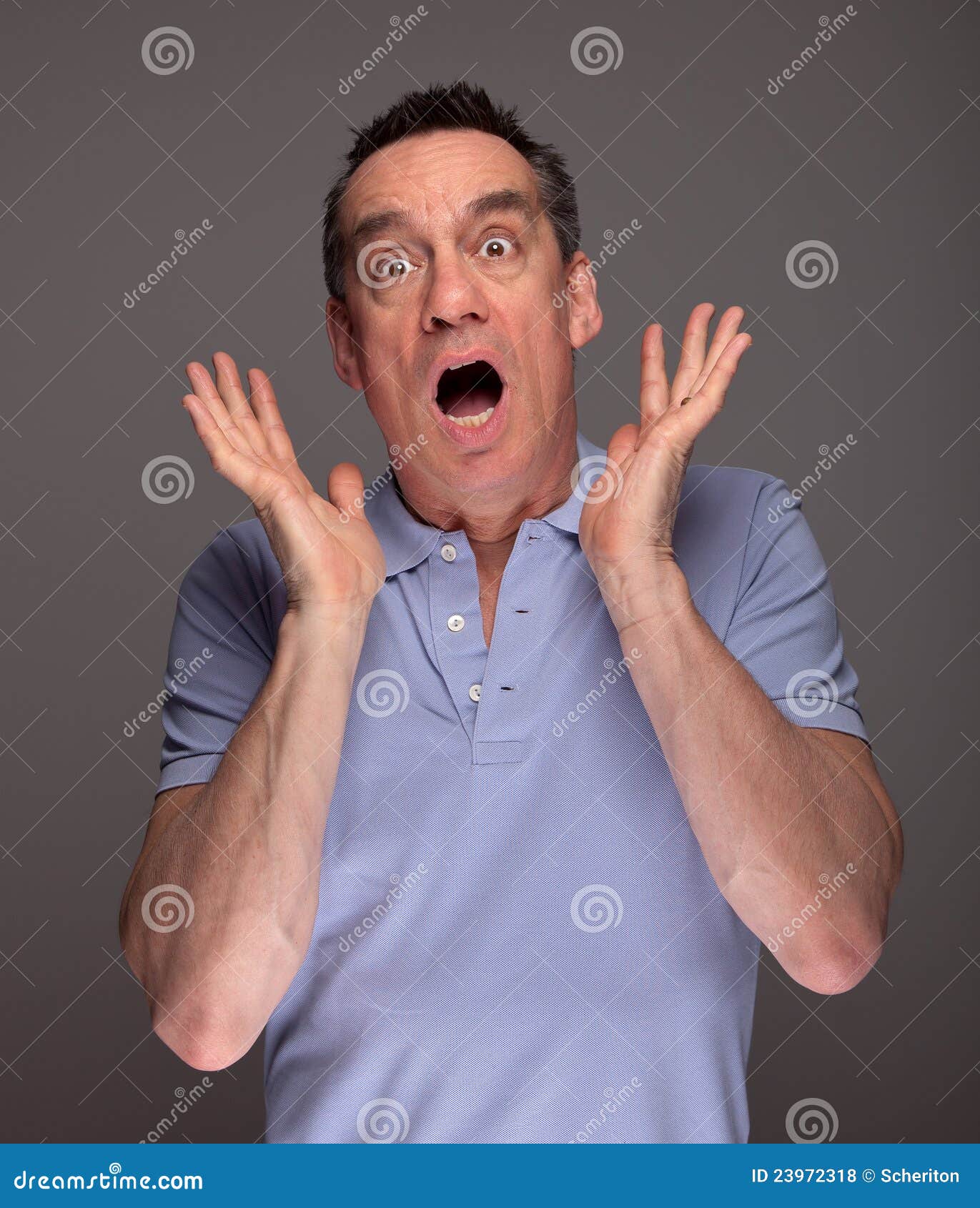 man-pulling-face-screaming-shock-23972318.jpg